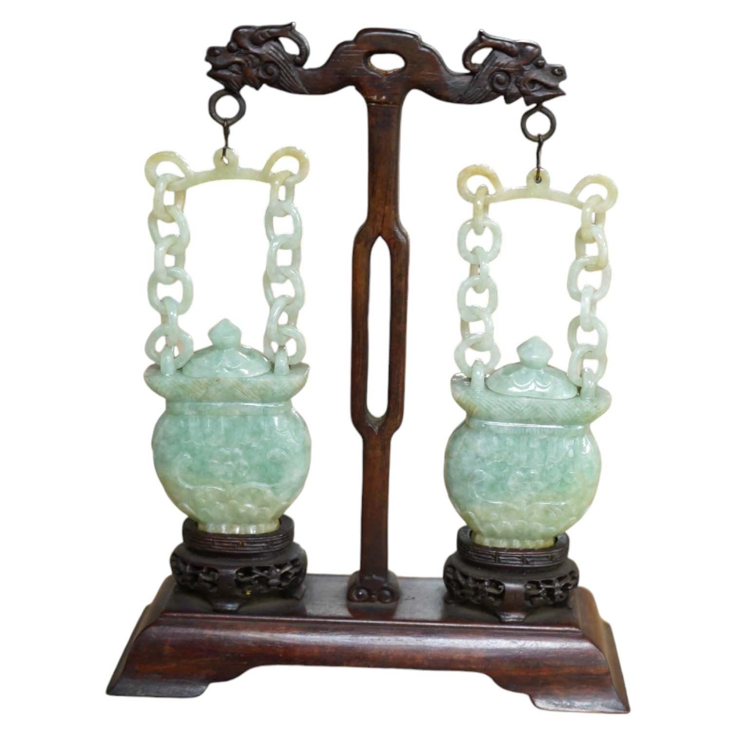 A pair of Chinese jadeite hanging baskets and covers, with original stand and hanging support, first half 20th century, 18cm high. Condition - good